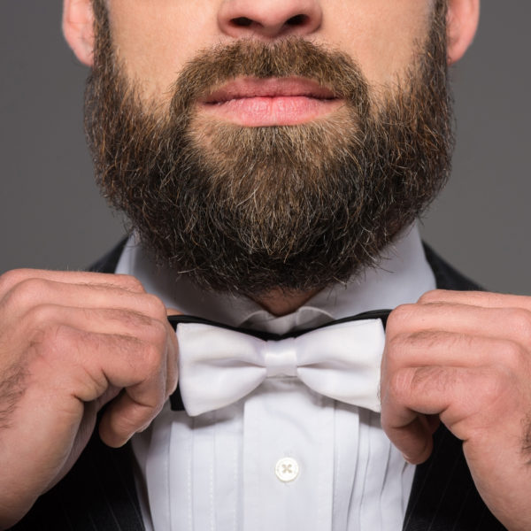 man with beard wearing white tie